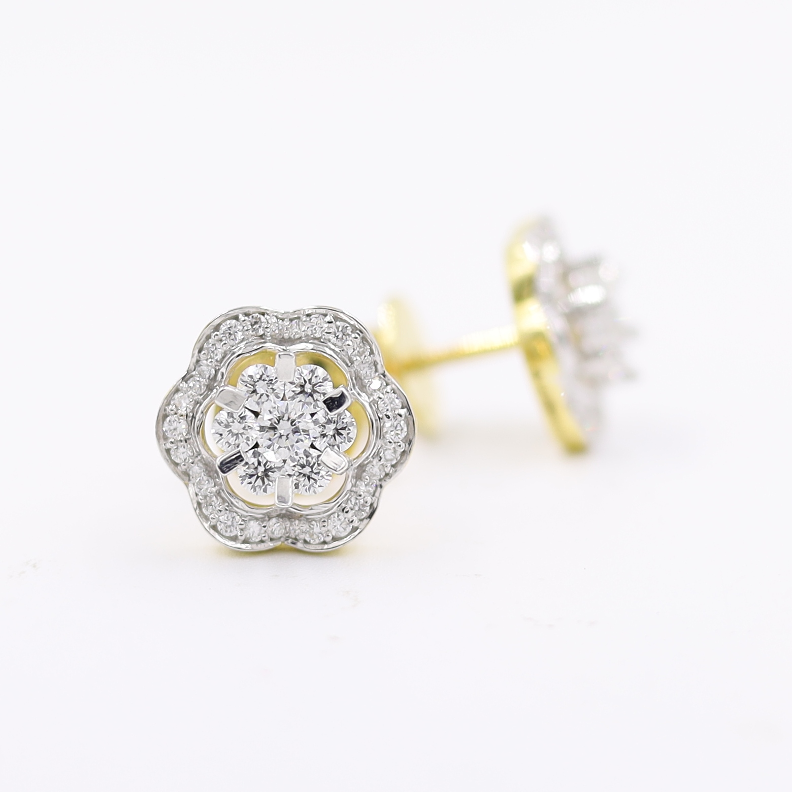 14kt Ethereal Floral Earrings topped with a round pressure-set diamond.
