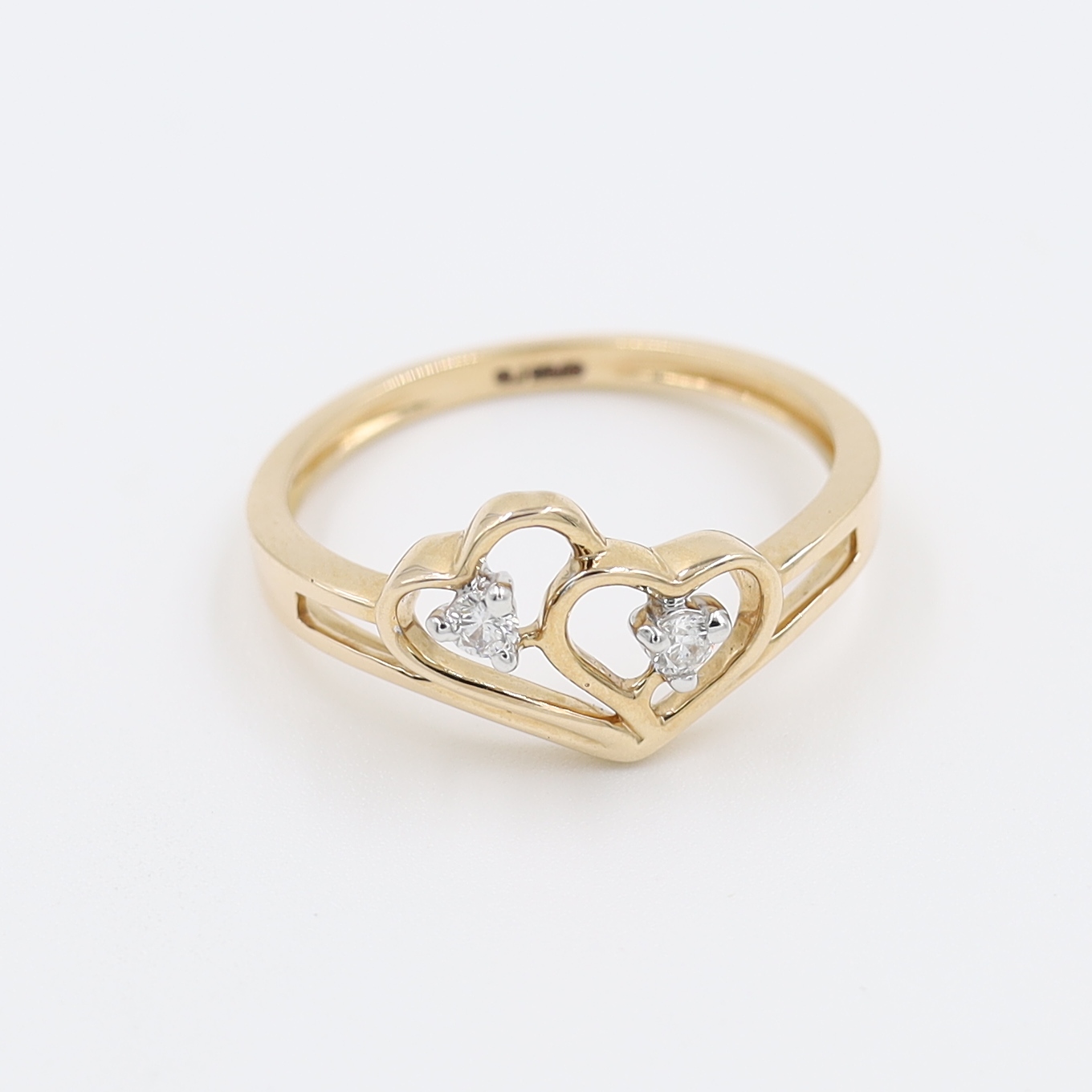 14Kt Rose Gold Ring In Shape Of Hearts With Two Diamond on It