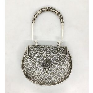 Hallmarked silver shoulder bag in fine carvings with designer handle