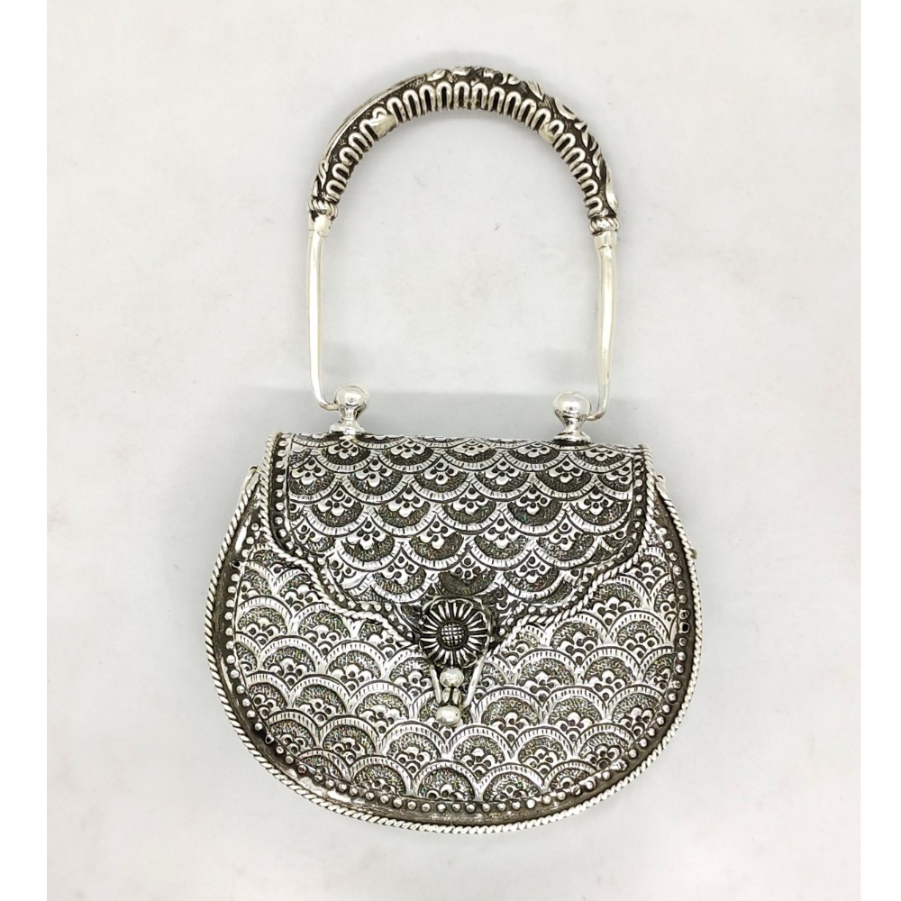 Hallmarked silver shoulder bag in fine carvings with designer handle