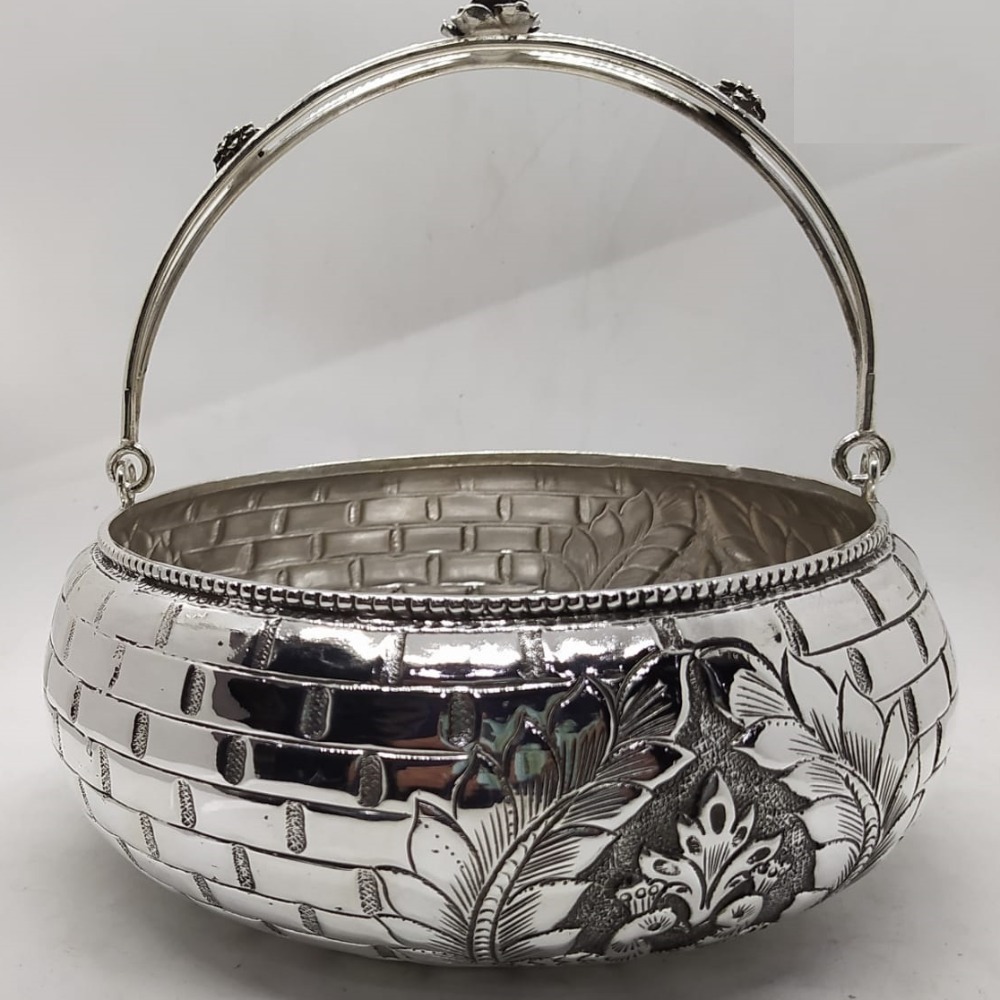 Pure silver flower basket with stylish handle in tile textur.