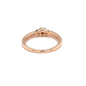 Delicate diamond engagement ring with pressure setting