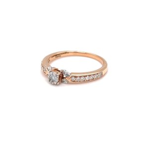 Delicate diamond engagement ring with pressure setting