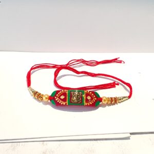 Gold rakhi for ganpati design