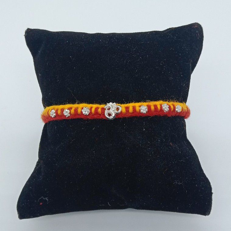 800 silver om design rakhi