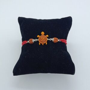 silver om design rakhi