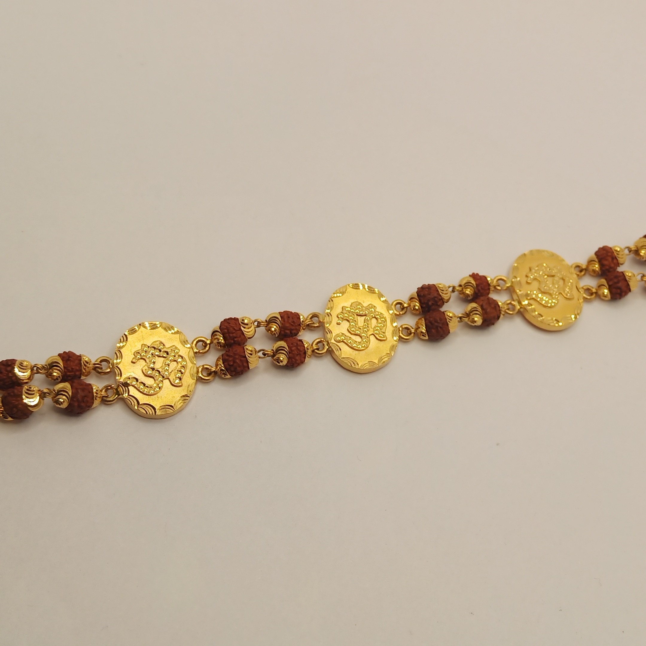 916 gold om with rudraksh bracelet