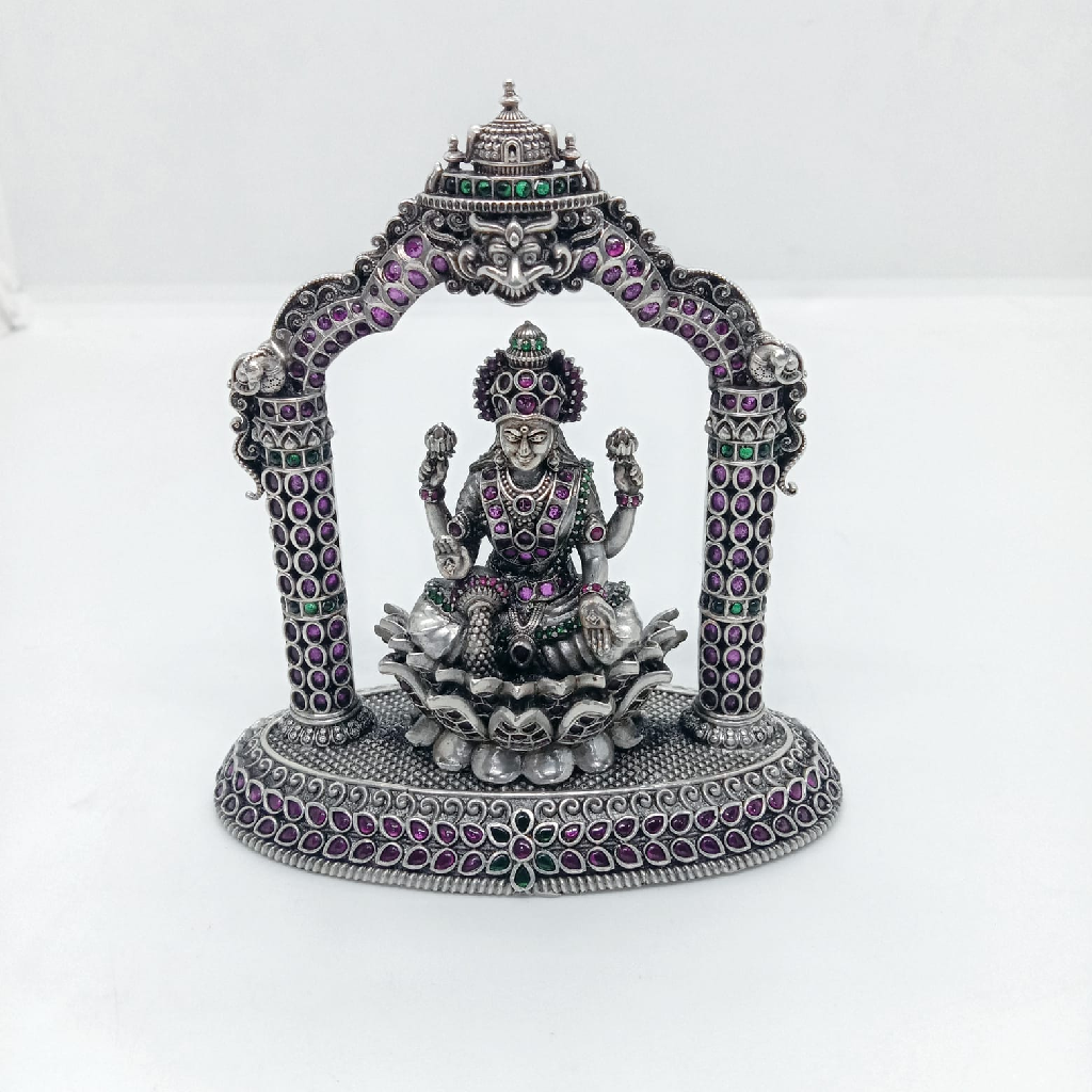 Unique idol of goddess laxmi in pure silver sitting on a lotus