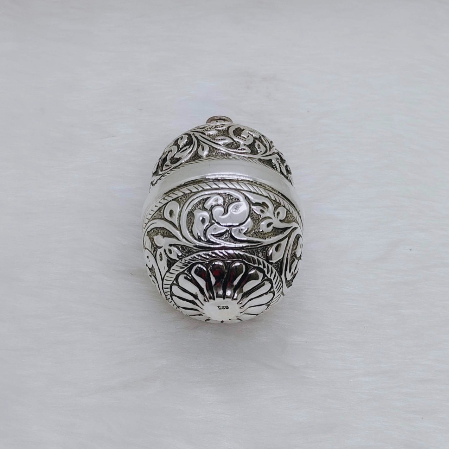 Real silver nariyal in antique carvings for pujan and by puran