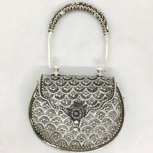 Real silver hand bag in fine carvings and studded with handle