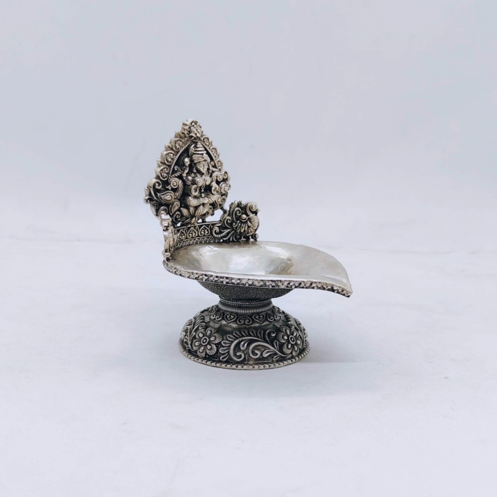 Hallmarked silver kamakshi lamp with peacocks in antique finish