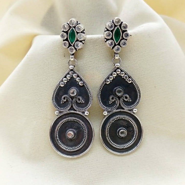 Twinning peacock heart shaped long dangler earrings with bulleye