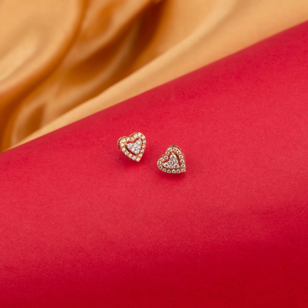 Dainty 14kt diamond heart stud earrings