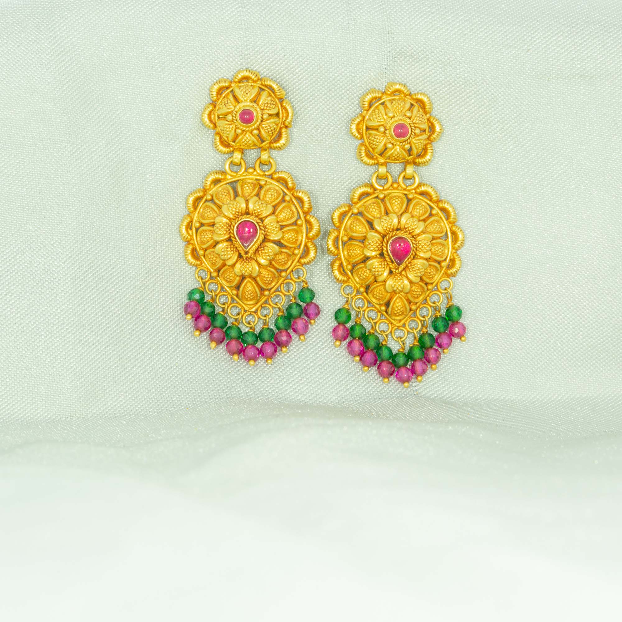 Contemporary gold jhumka earrings