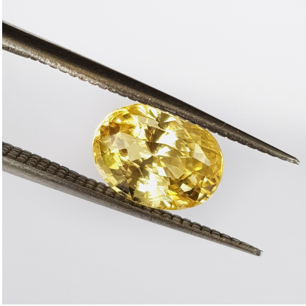 3.30 carat (3.63 ratti) natural oval yellow-sapphire pukhraj