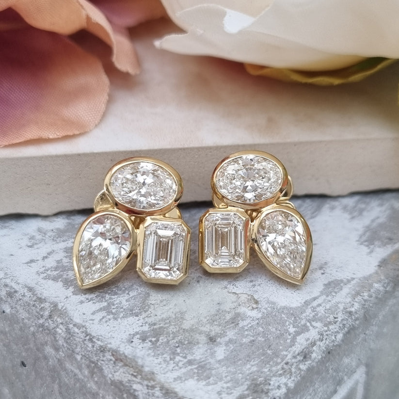 Stylish Pear Oval and Emerald Cut Diamond Earrings