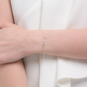Silver bracelet with mother and baby elephant charm.