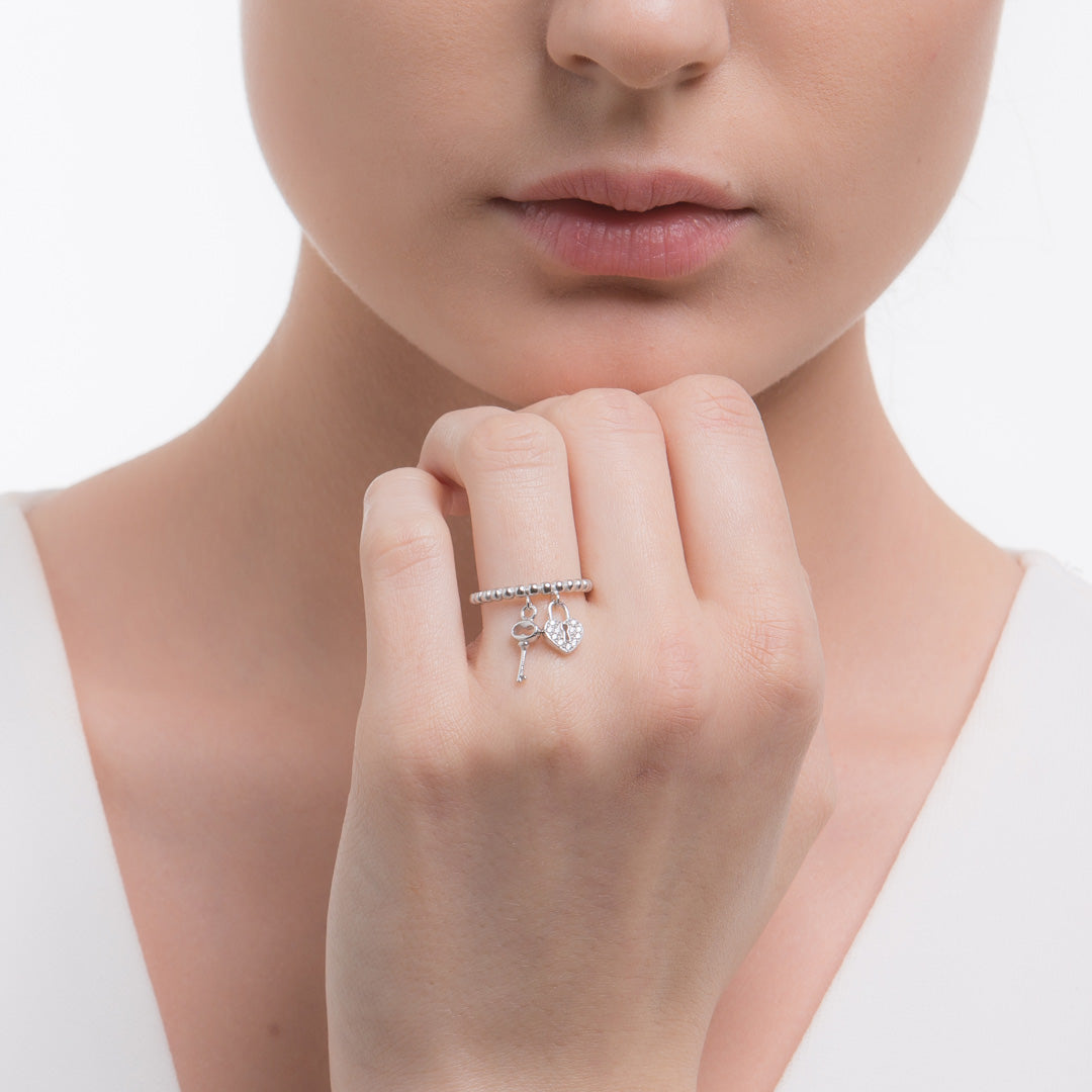 Silver and cubic zirconia ring with key and lock charms. - Image 3